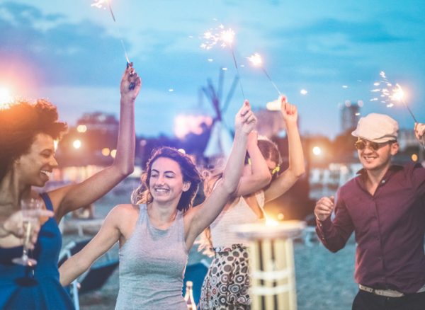 Event attendees holding sparklers in the air