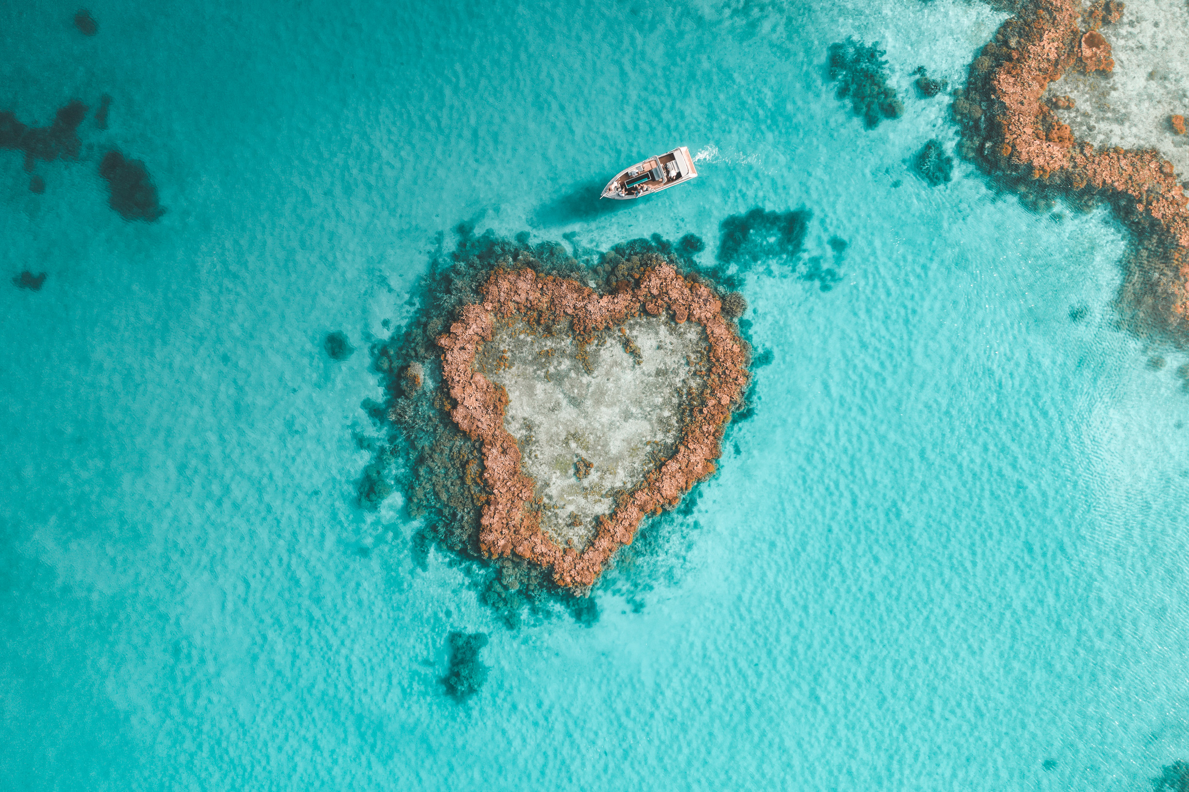 Signature Experiences of Australia - aerial view of hearted shaped reef