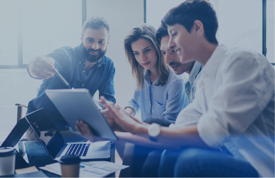 A team of business person looking at table